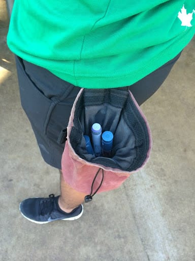 insulin pens in person’s bag attached to their hip