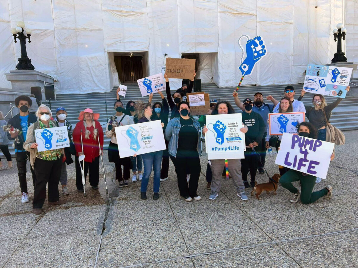 Pump4Life group holding up signs at a public health care rally